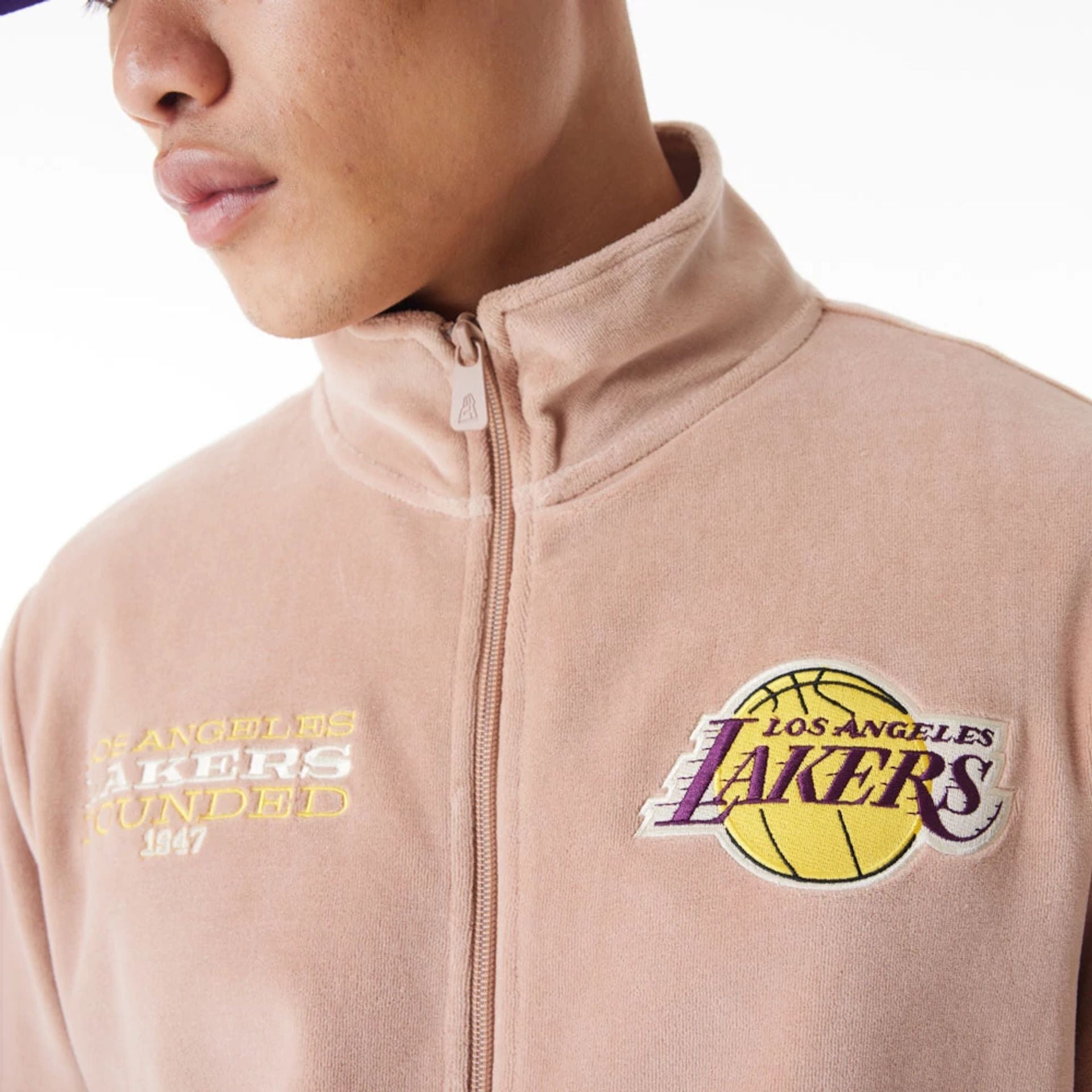 The Male model is wearing LA Lakers NBA Lifestyle Velour Beige Track Jacket  2