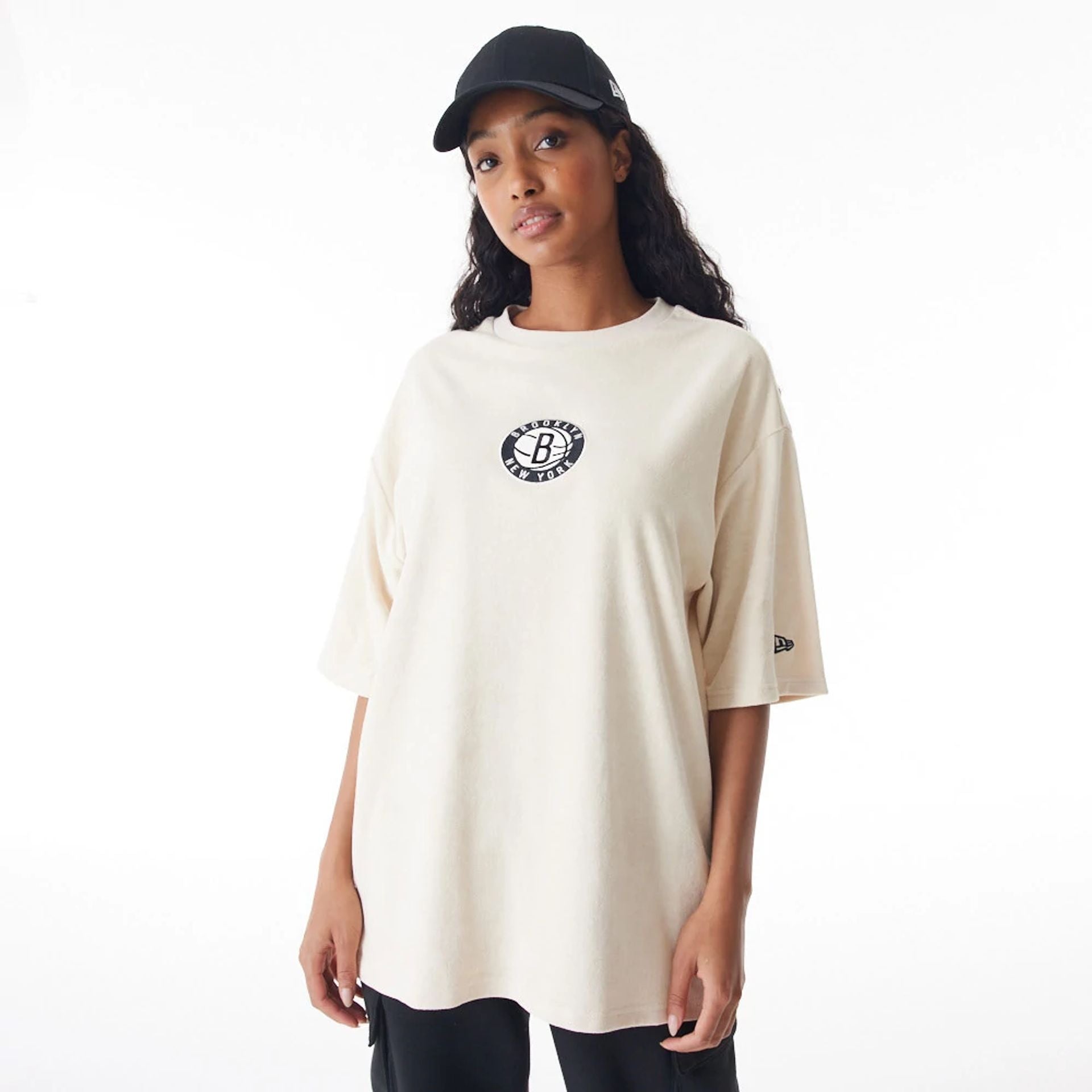 The Male model is wearing Brooklyn Nets NBA Lifestyle Velour Light Beige Oversized T-Shirt  2