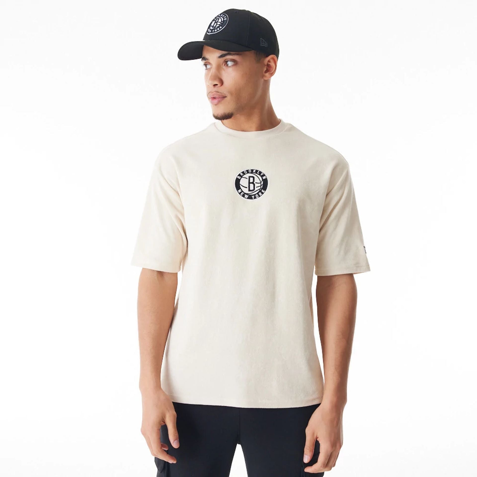 The Male model is wearing Brooklyn Nets NBA Lifestyle Velour Light Beige Oversized T-Shirt  4