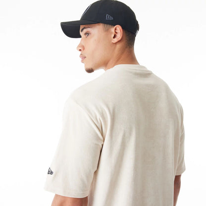 The Male model is wearing Brooklyn Nets NBA Lifestyle Velour Light Beige Oversized T-Shirt  7