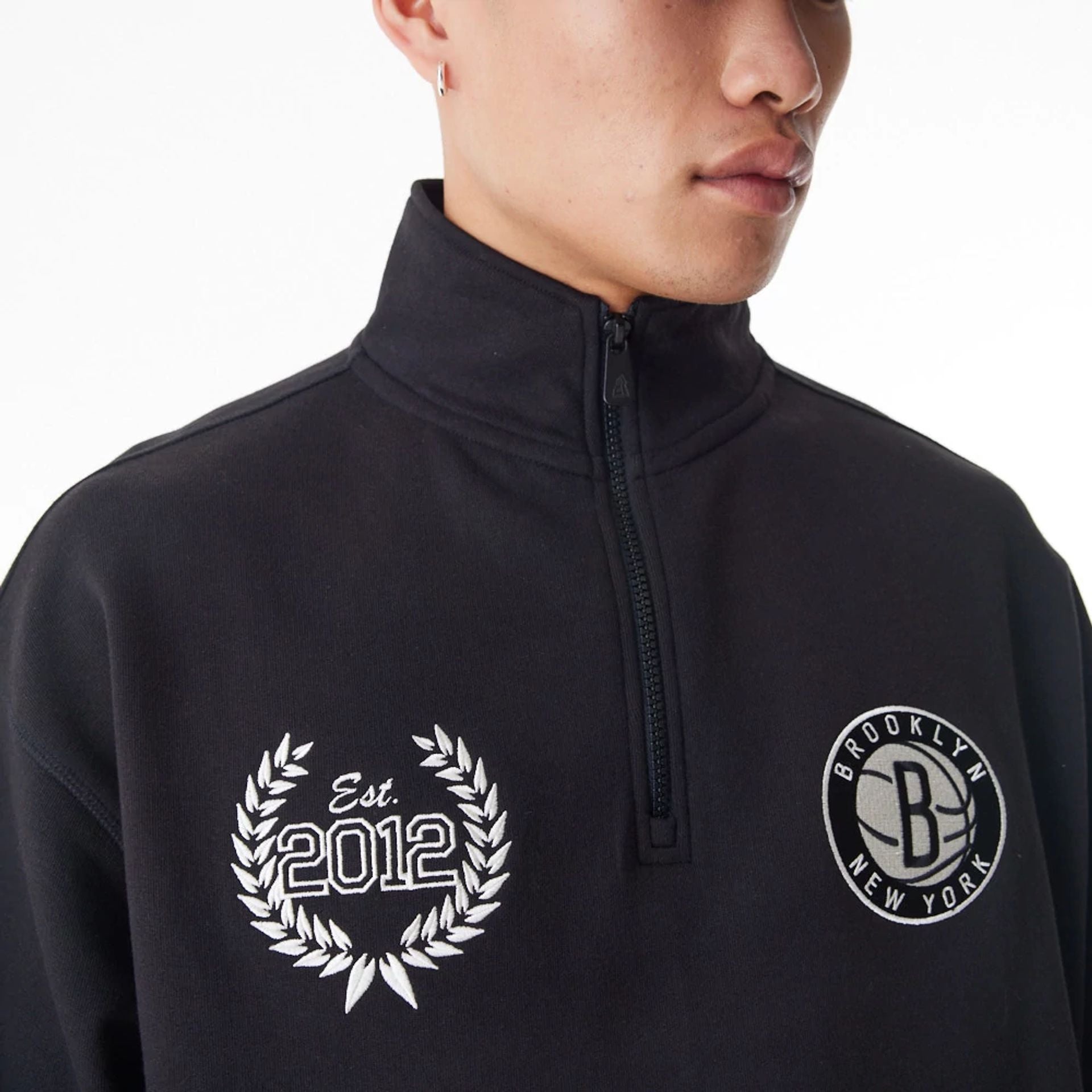 The Male model is wearing Brooklyn Nets NBA Lifestyle Black Quarter Zip Sweater  8