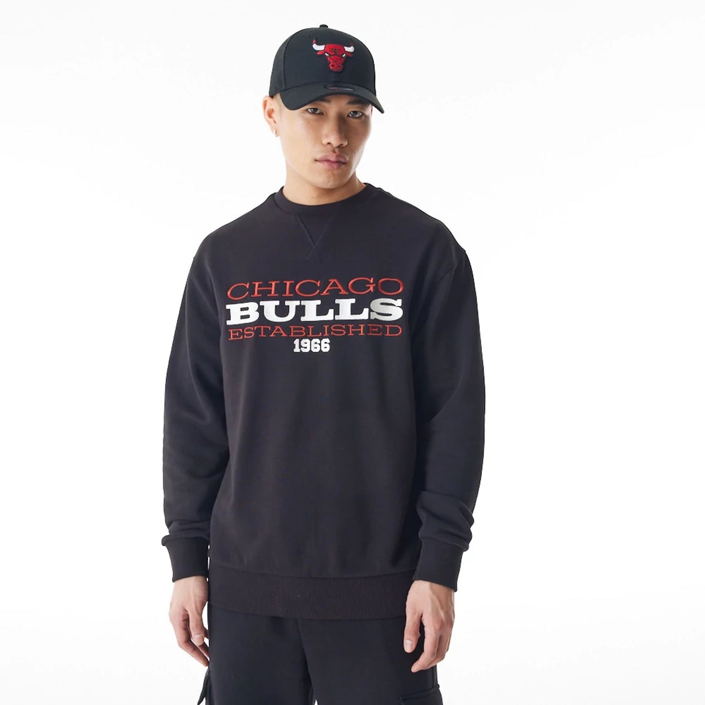 The Male model is wearing Chicago Bulls NBA Lifestyle Black Oversized Crew Neck Sweater  6