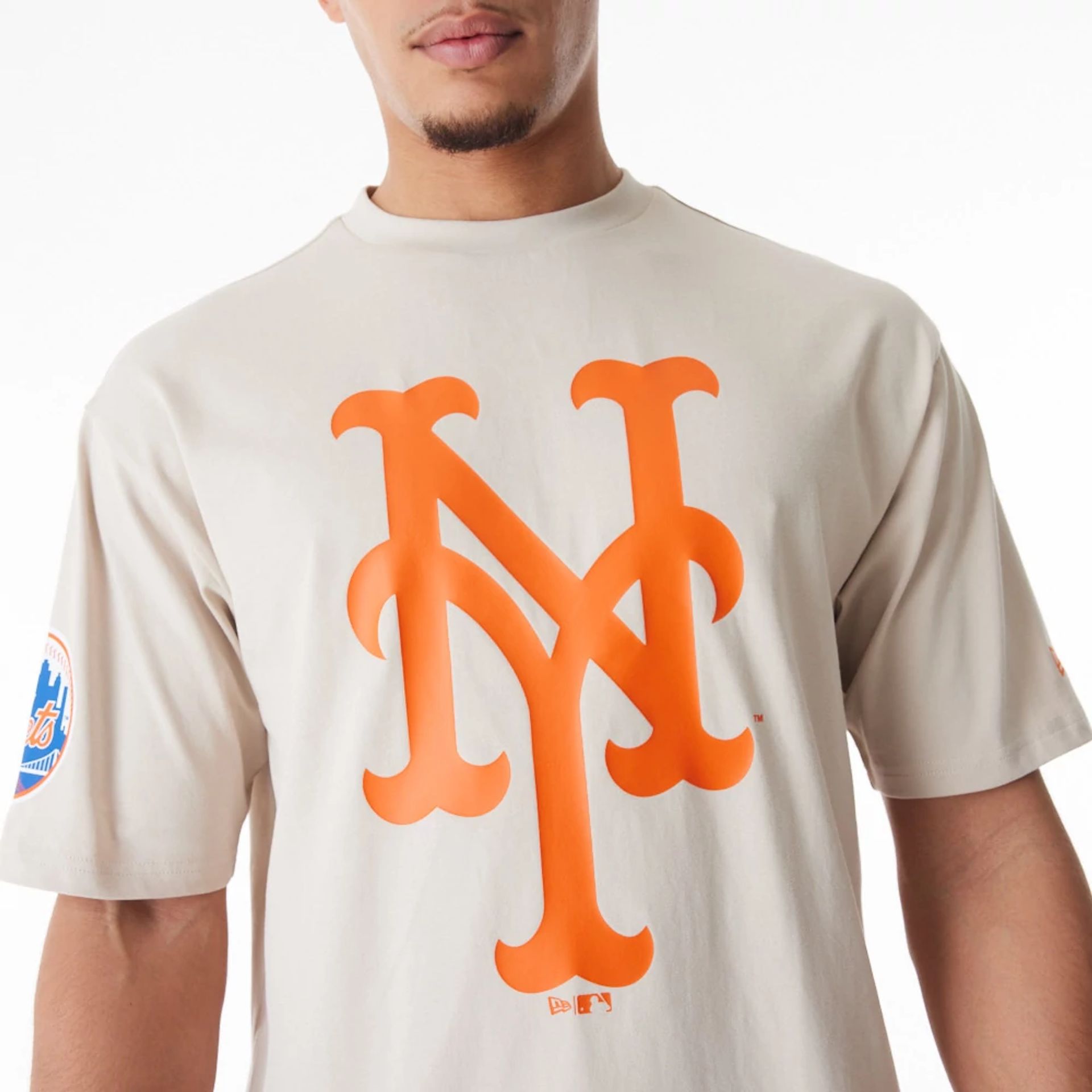 The Male model is wearing New York Mets MLB London Series 2024 Light Beige Oversized T-Shirt 5