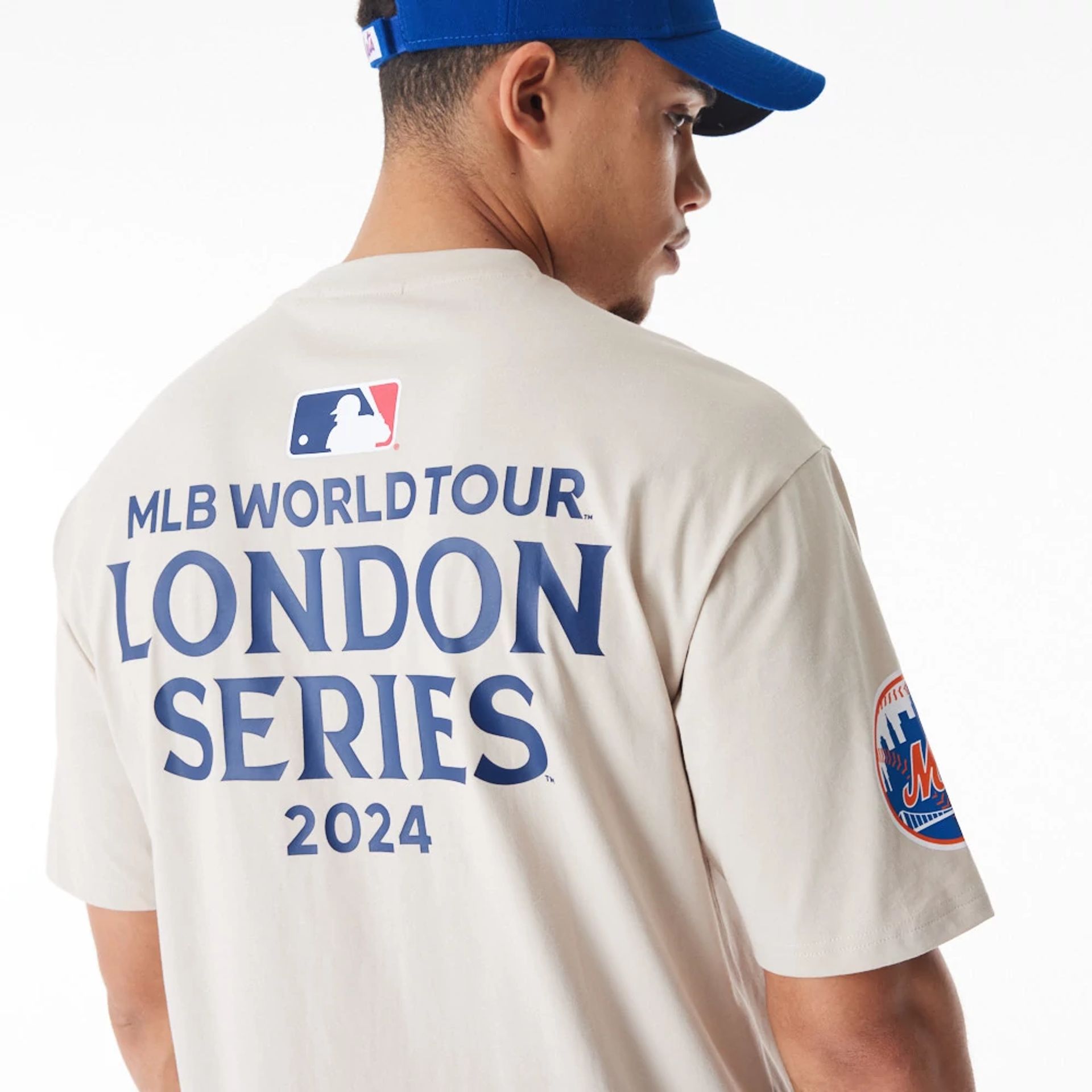 The Male model is wearing New York Mets MLB London Series 2024 Light Beige Oversized T-Shirt 6