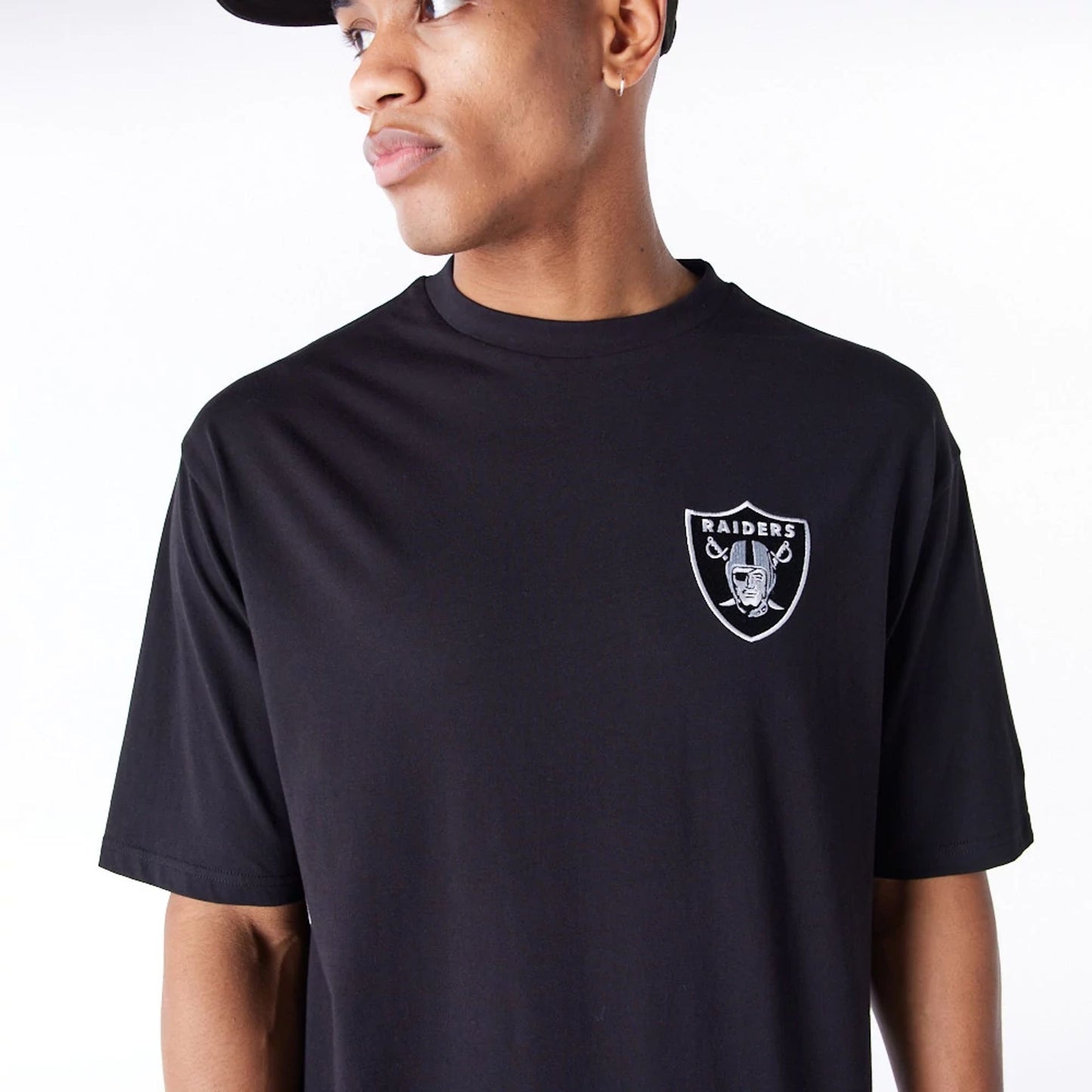 The Male model is wearing Las Vegas Raiders NFL League Essential Black Oversized T-Shirt  6