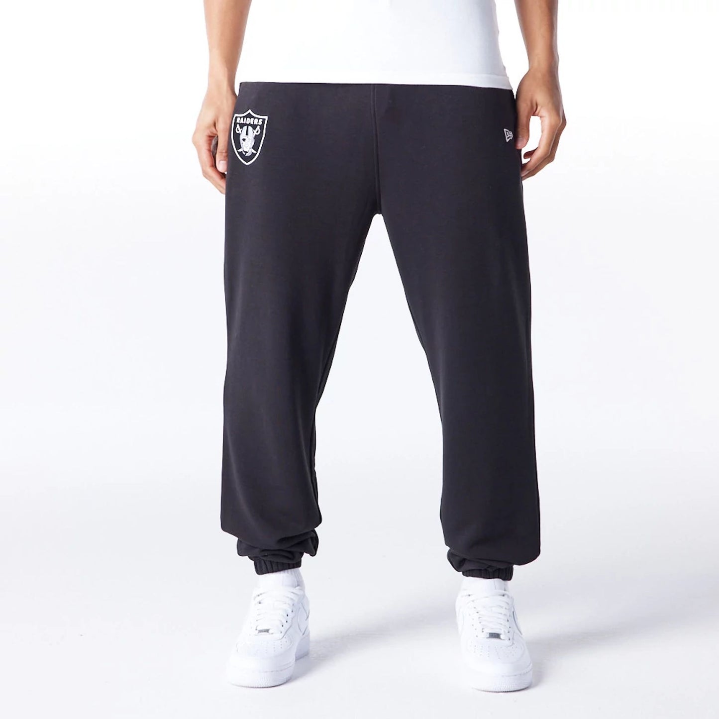 The Male model is wearing Las Vegas Raiders NFL League Essential Black Track Joggers  1