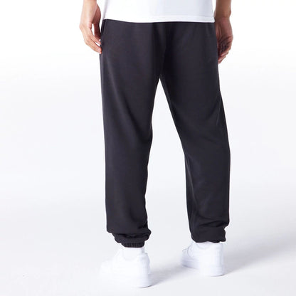 The Male model is wearing Las Vegas Raiders NFL League Essential Black Track Joggers  4