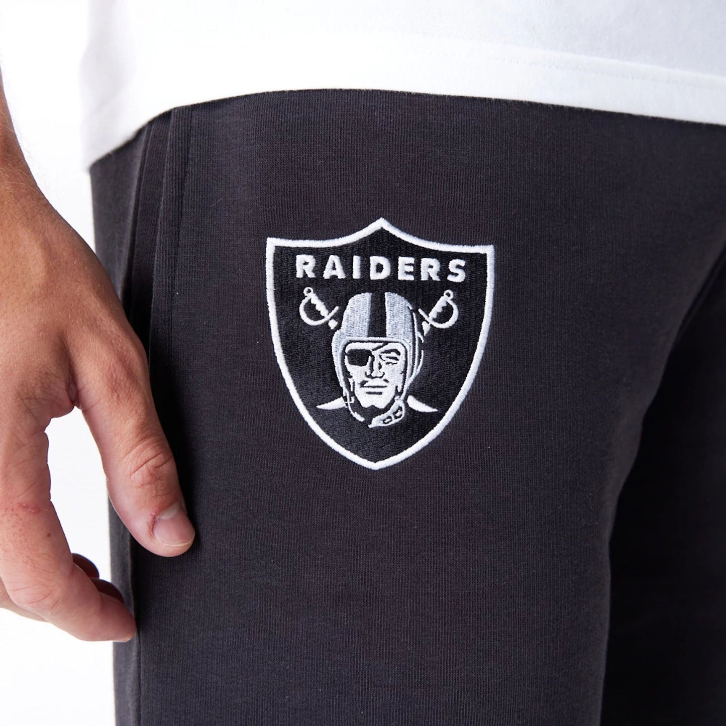 The Male model is wearing Las Vegas Raiders NFL League Essential Black Shorts  5