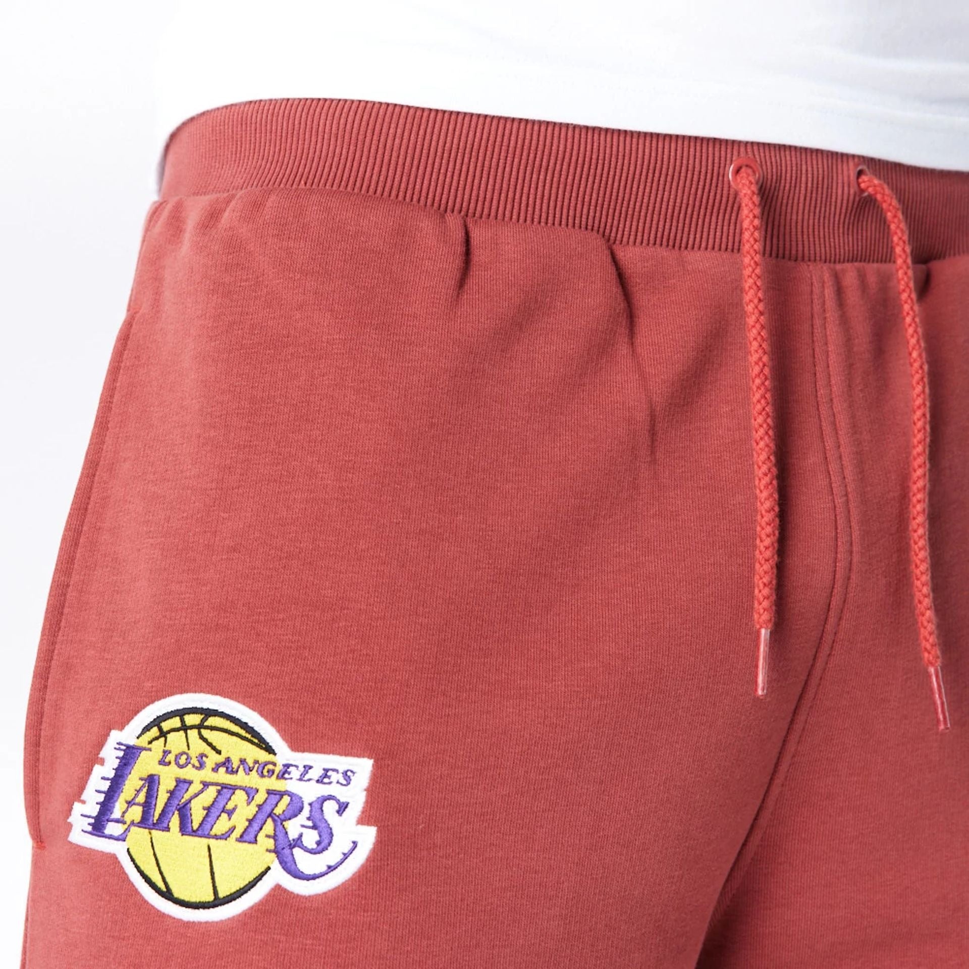 The Male model is wearing LA Lakers League Essential Brown Shorts  5