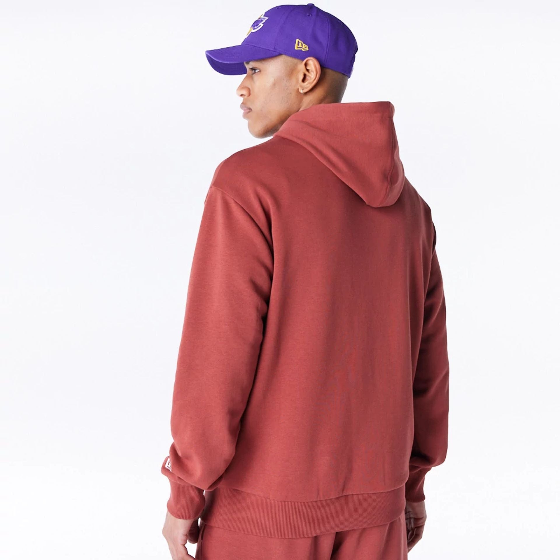 The Male model is wearing LA Lakers League Essential Brown Oversized Pullover Hoodie  3