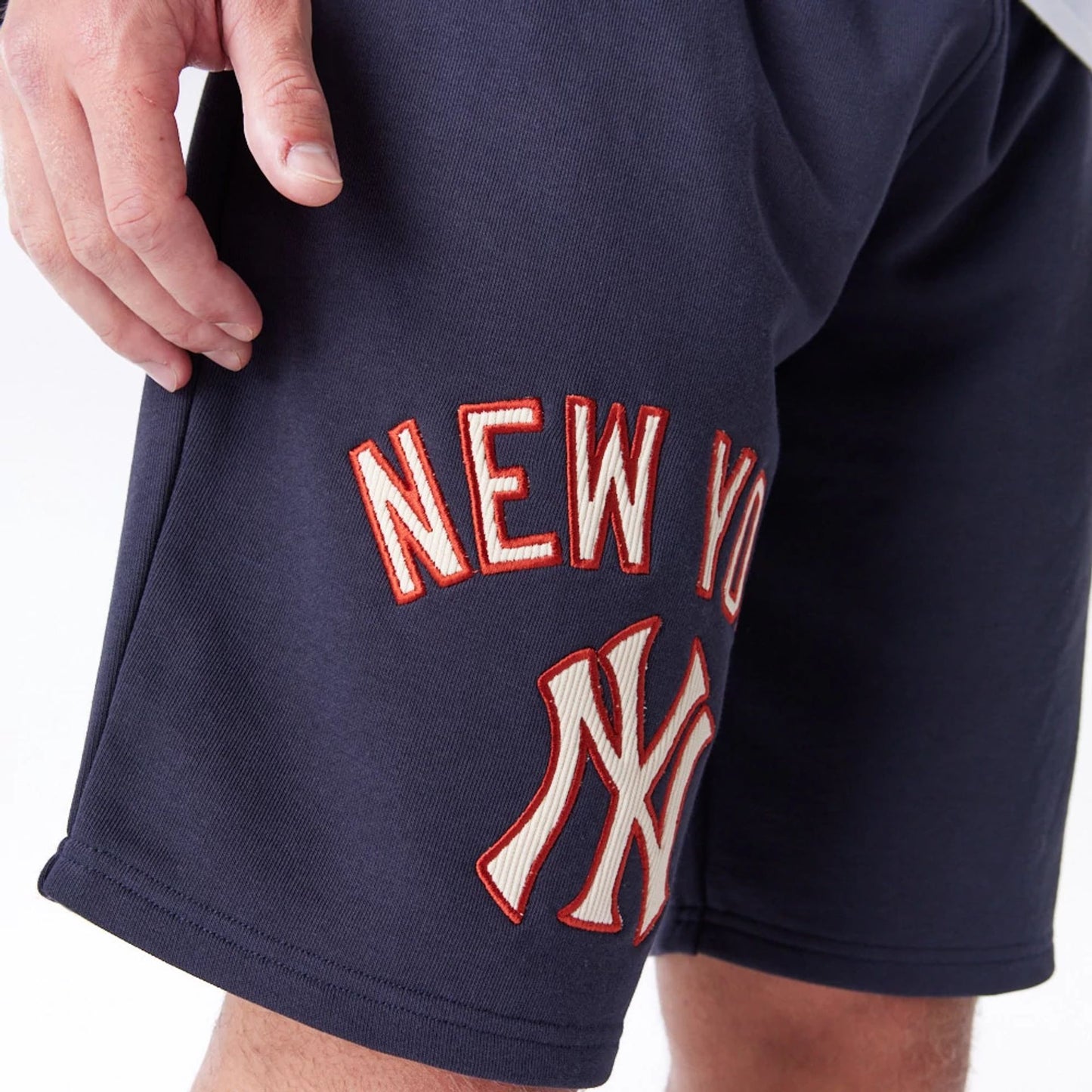 The Male model is wearing New York Yankees MLB Lifestyle Navy Shorts  4