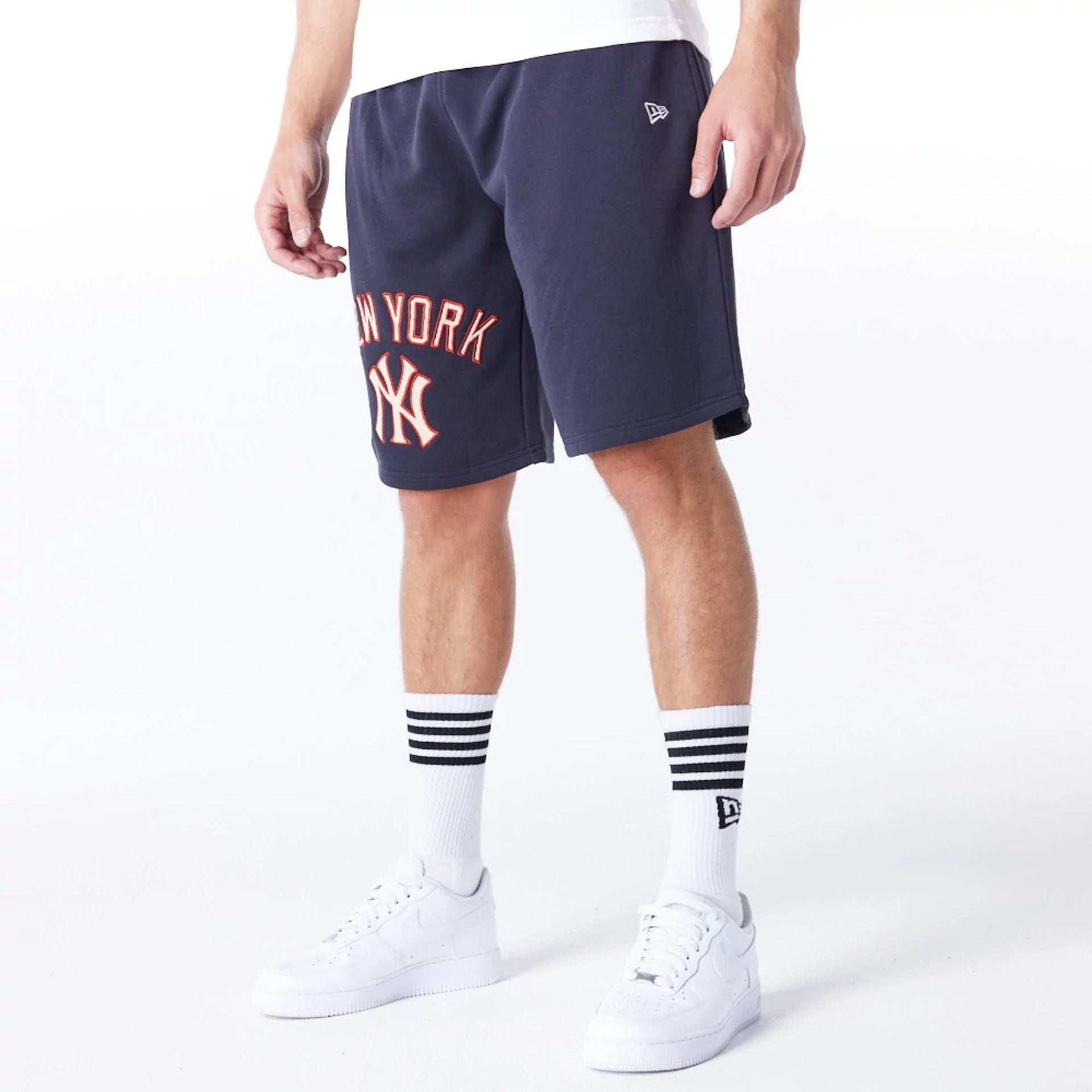 The Male model is wearing New York Yankees MLB Lifestyle Navy Shorts  2