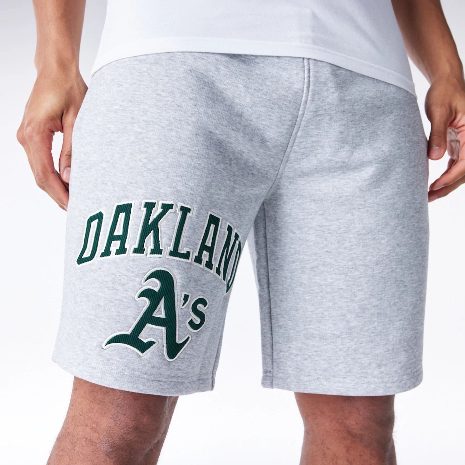 The Male model is wearing Oakland Athletics MLB Lifestyle Grey Shorts  1