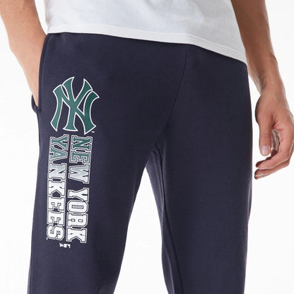 The Male model is wearing New York Yankees MLB Gradient Graphic Navy Joggers  4