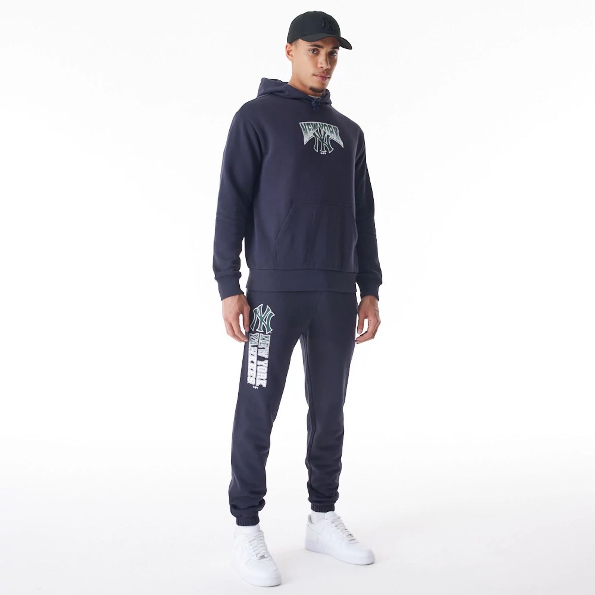 The Male model is wearing New York Yankees MLB Gradient Navy Oversized Pullover Hoodie  5