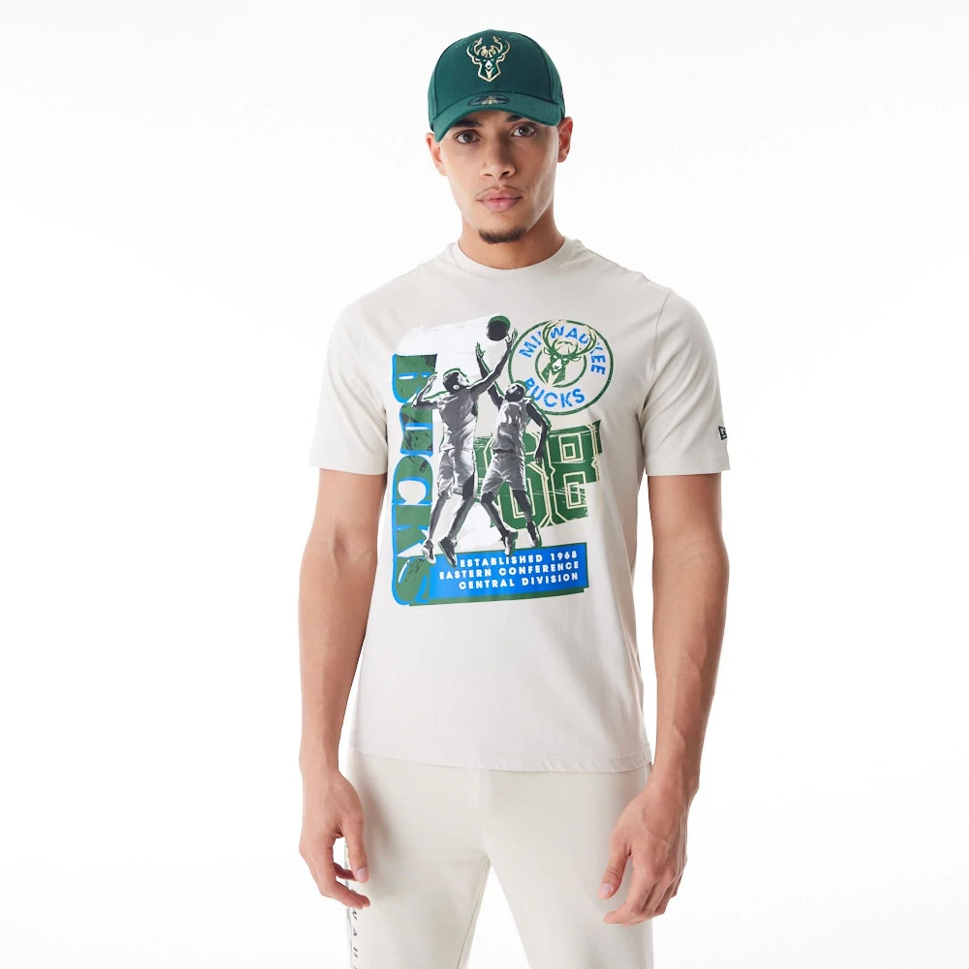 The Male model is wearing Milwaukee Bucks NBA Player Graphic Cream T-Shirt  1