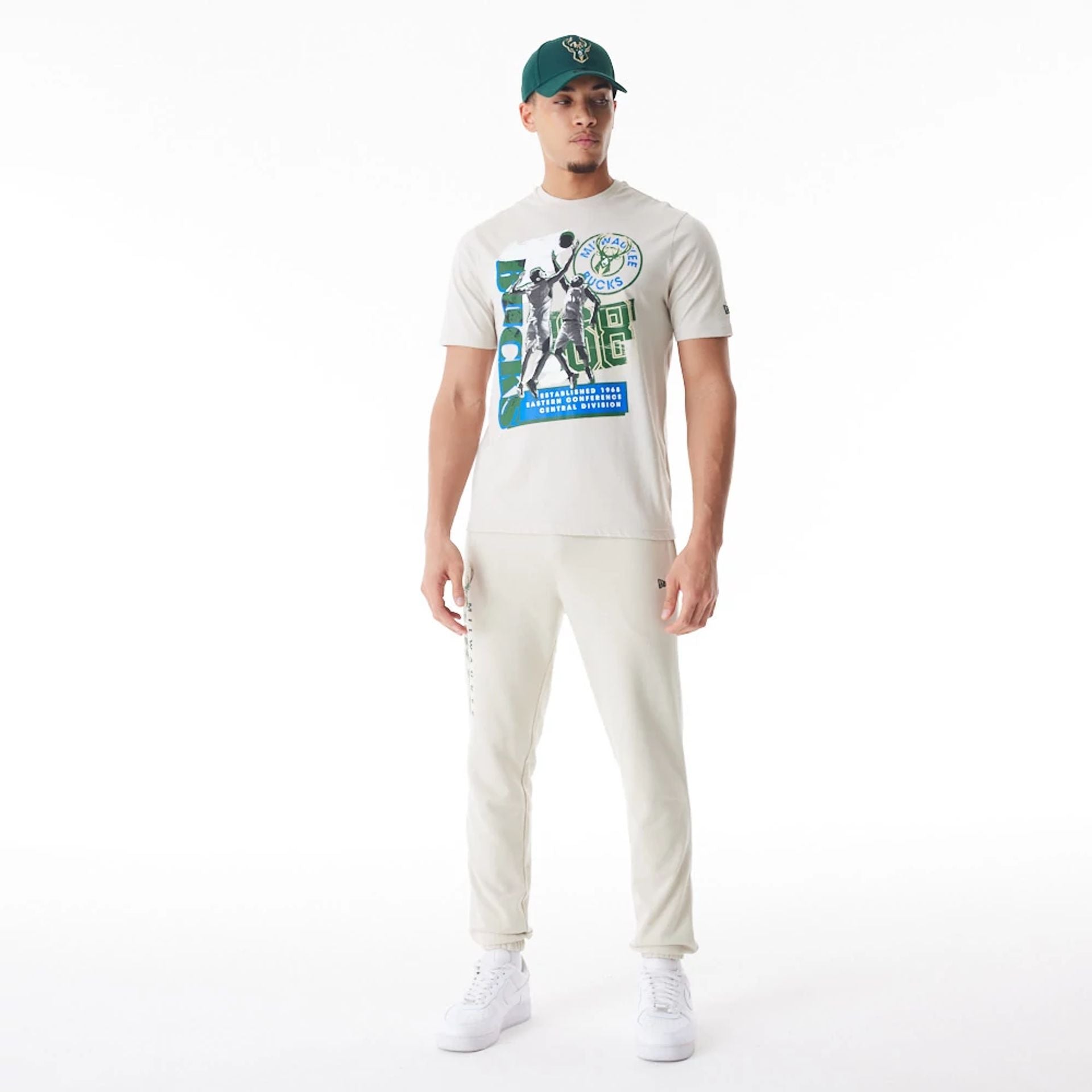 The Male model is wearing Milwaukee Bucks NBA Player Graphic Cream T-Shirt  6