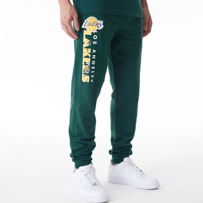 The Male model is wearing LA Lakers NBA Graphic Dark Green Joggers  1