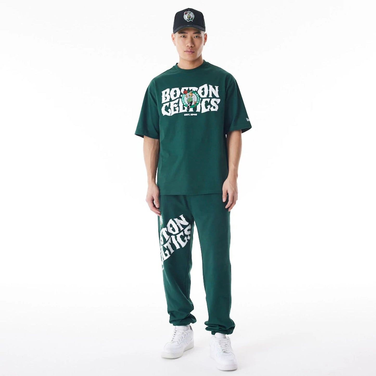 The Male model is wearing Boston Celtics NBA Graphic Dark Green Oversized T-Shirt  4