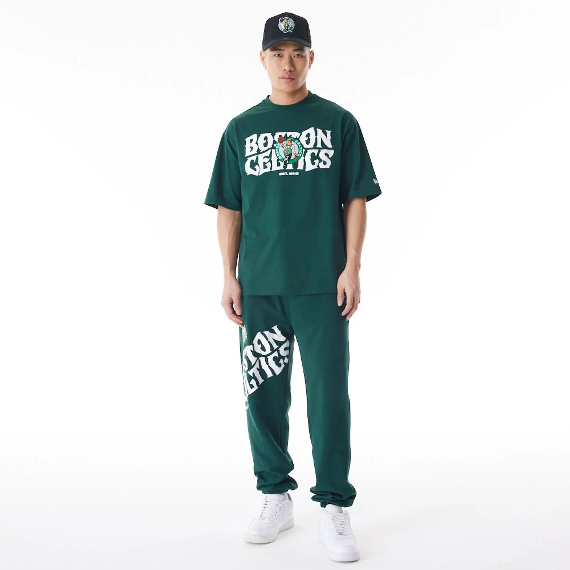 The Male model is wearing Boston Celtics NBA Graphic Dark Green Oversized T-Shirt  4