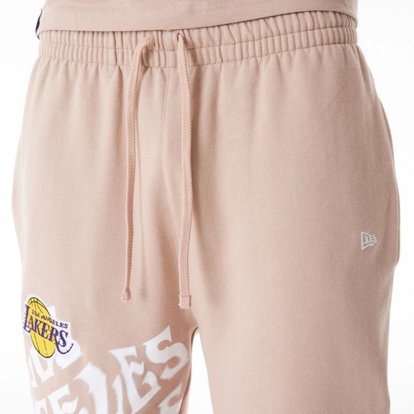 The Male model is wearing LA Lakers NBA Graphic Beige Joggers  2