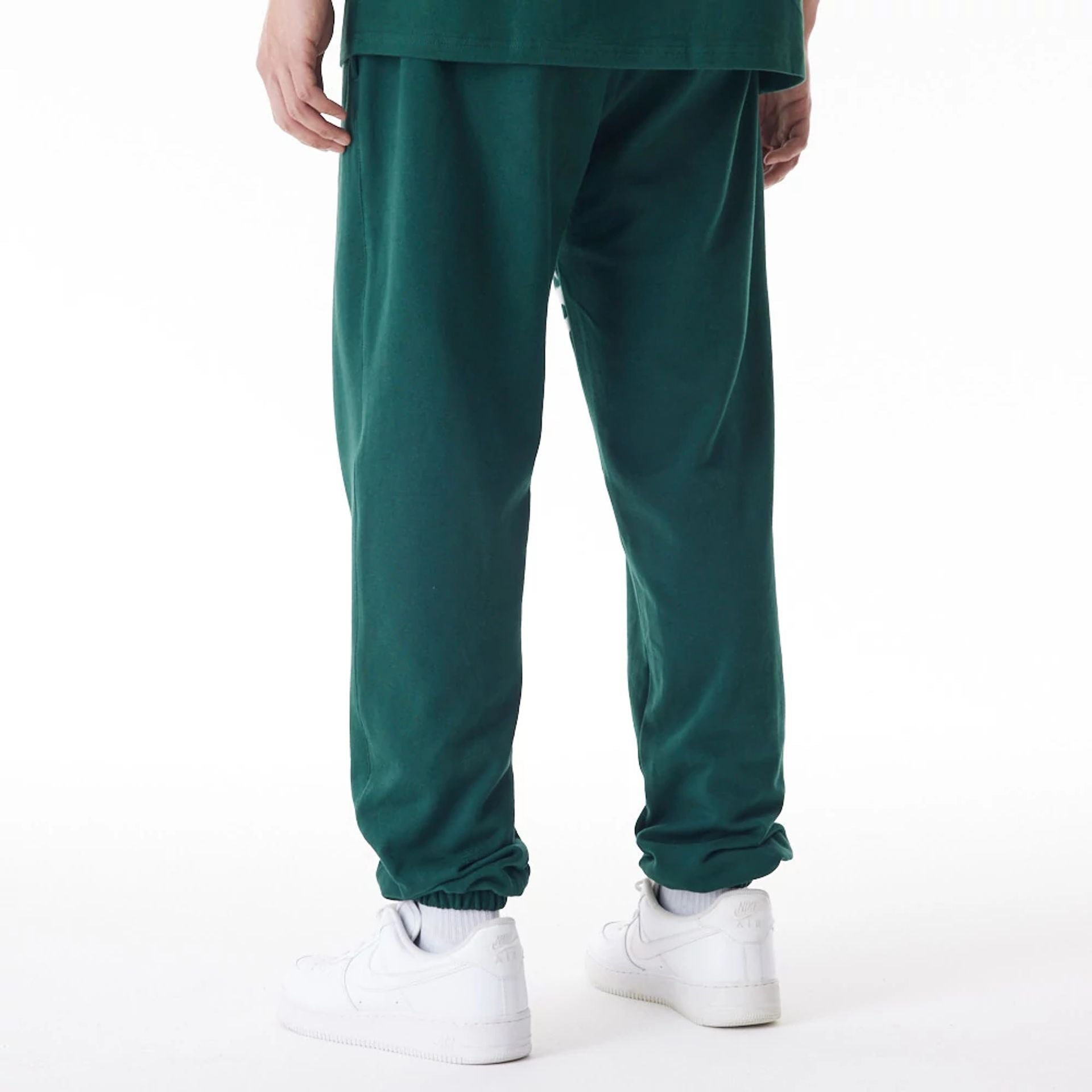 The Male model is wearing Boston Celtics NBA Graphic Dark Green Joggers  2