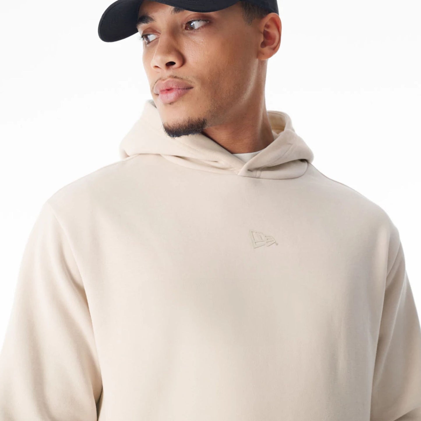 The Male model is wearing  New Era Flag Cream Oversized Pullover Hoodie  3