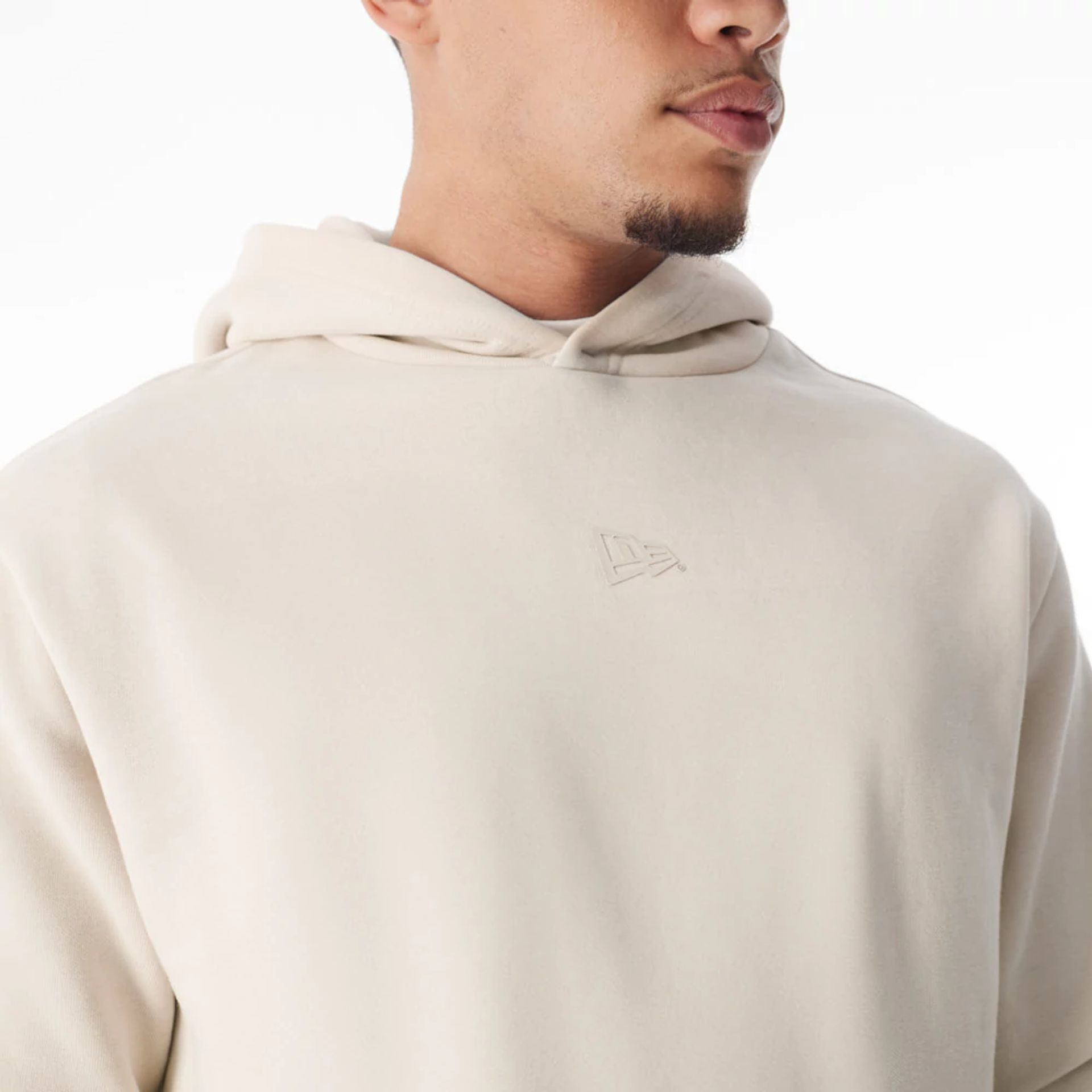 The Male model is wearing  New Era Flag Cream Oversized Pullover Hoodie  6