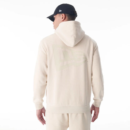 The Male model is wearing  New Era Flag Cream Oversized Pullover Hoodie  7