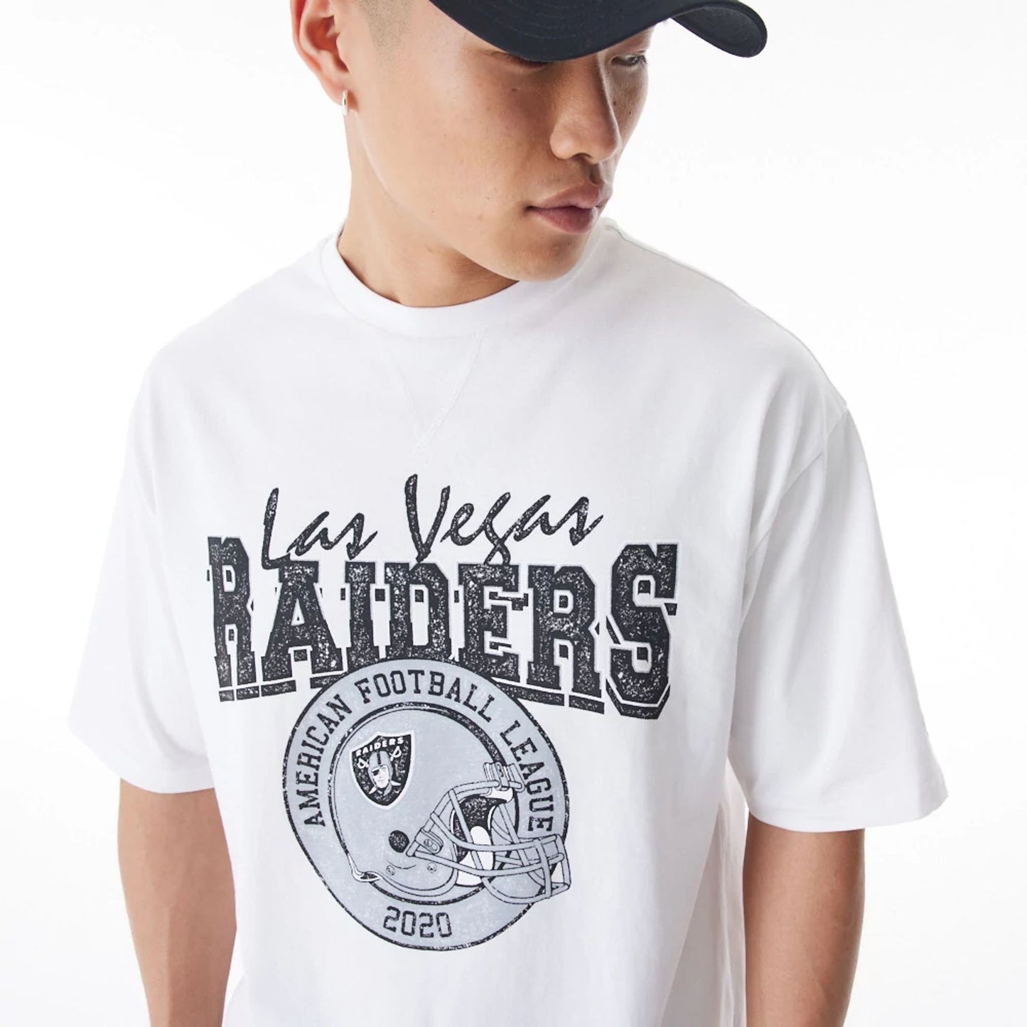 The Male model is wearing Las Vegas Raiders NFL Helmet Graphic White Oversized T-Shirt  3