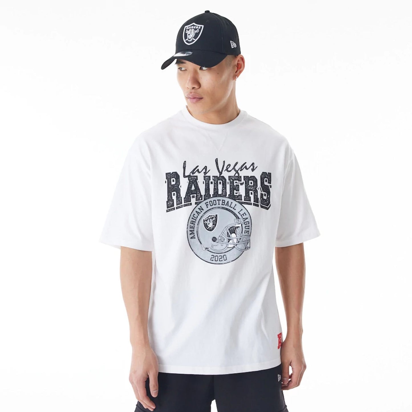 The Male model is wearing Las Vegas Raiders NFL Helmet Graphic White Oversized T-Shirt  1