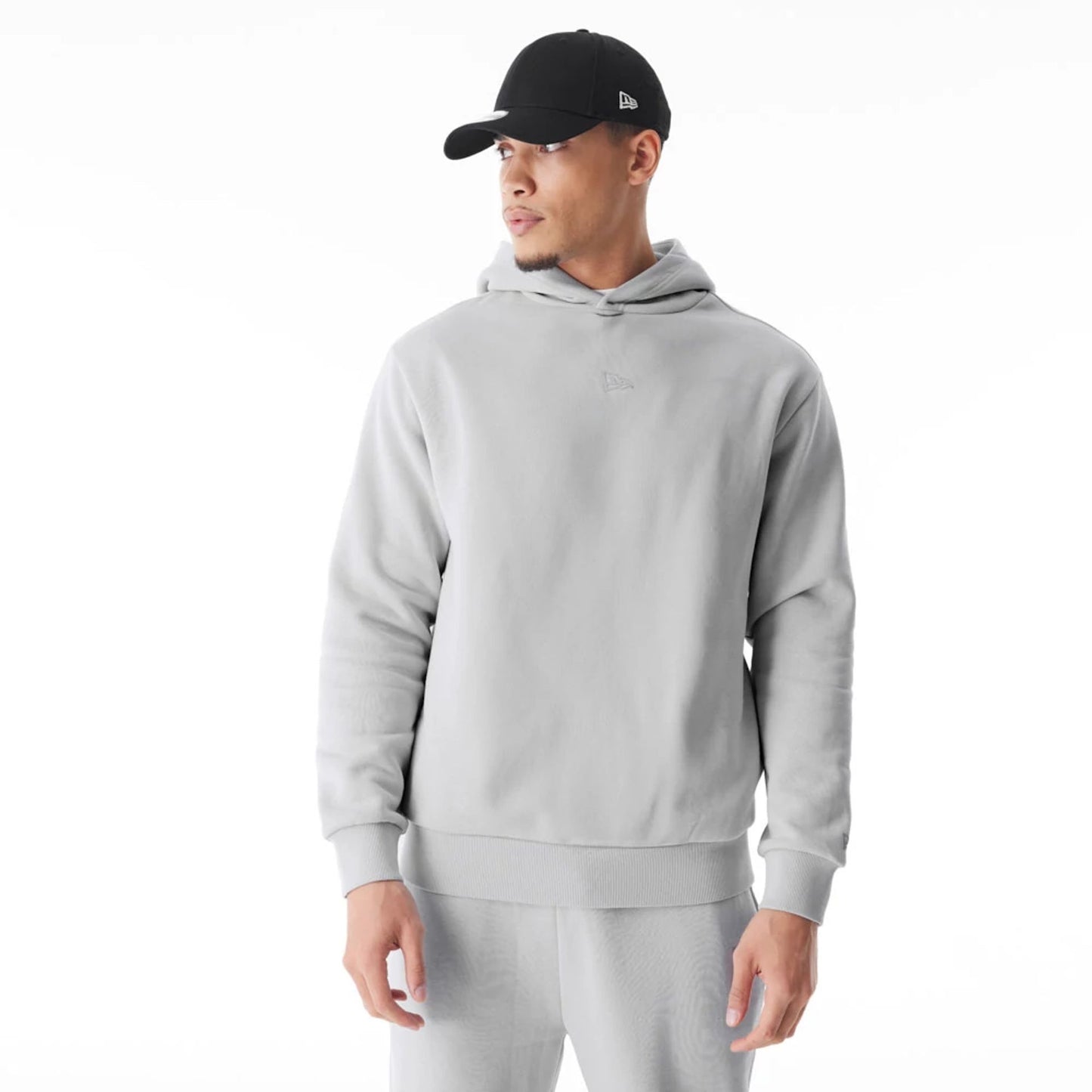 The Male model is wearing  New Era Flag Grey Oversized Pullover Hoodie  1