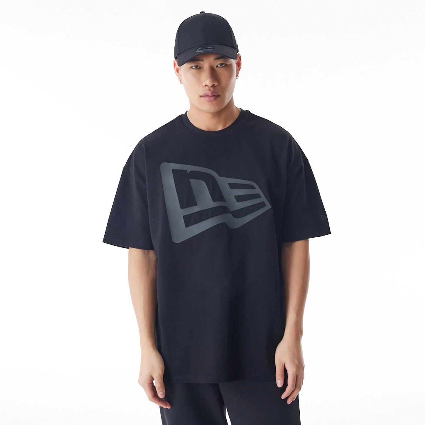 The Male model is wearing  New Era Flag Black Oversized T-Shirt  1