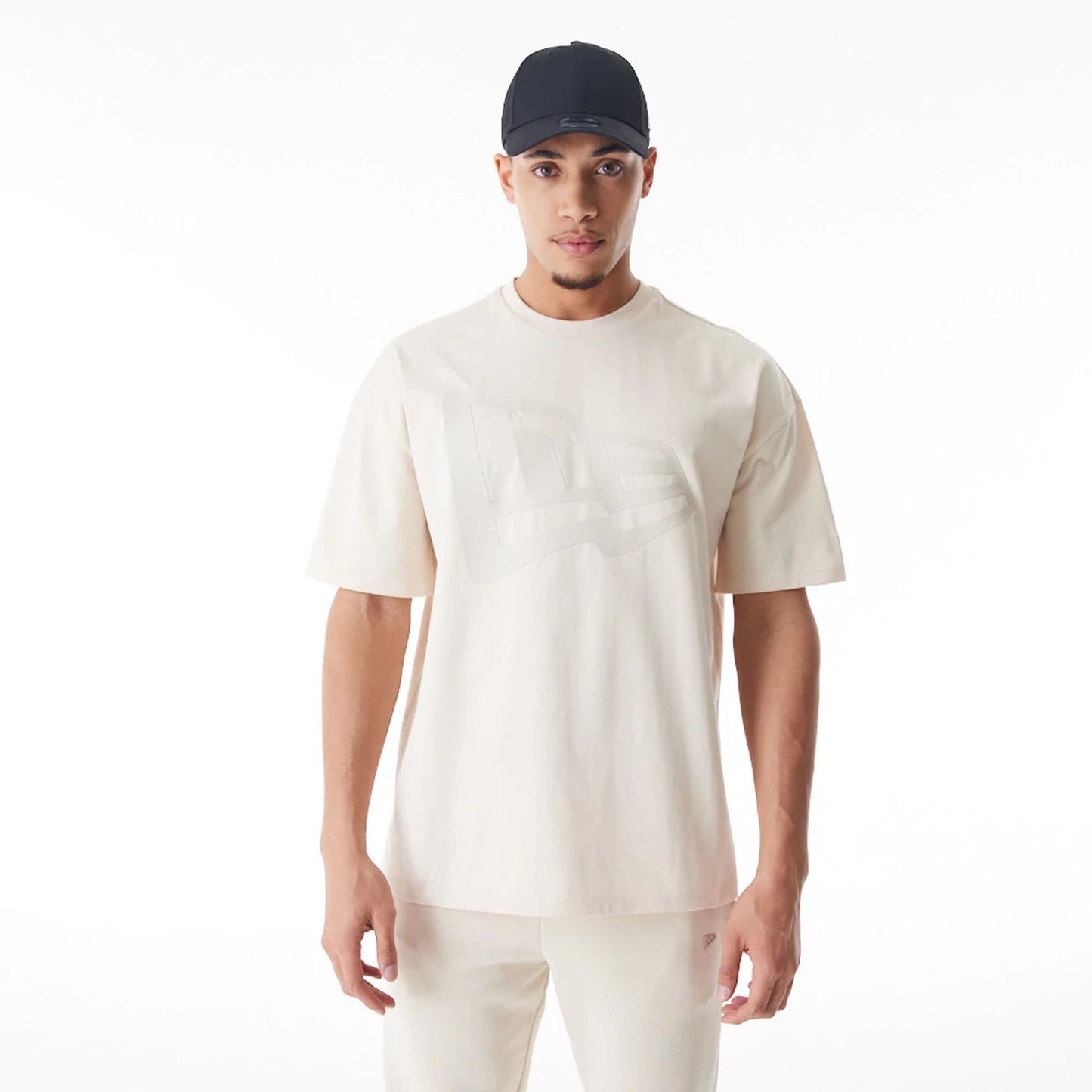 The Male model is wearing  New Era Flag Cream Oversized T-Shirt  6