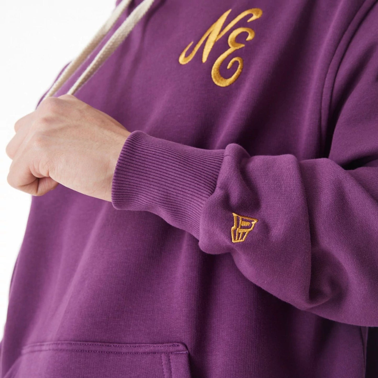 The Male model is wearing  New Era Script Logo Dark Purple Oversized Pullover Hoodie  14