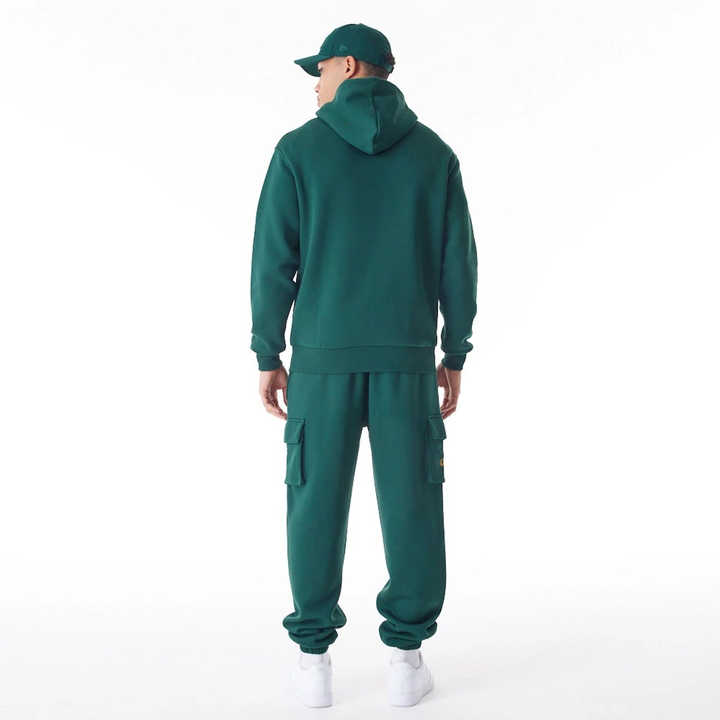 The Male model is wearing  New Era Script Logo Dark Green Oversized Pullover Hoodie  5