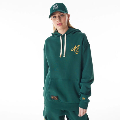 The Male model is wearing  New Era Script Logo Dark Green Oversized Pullover Hoodie  3