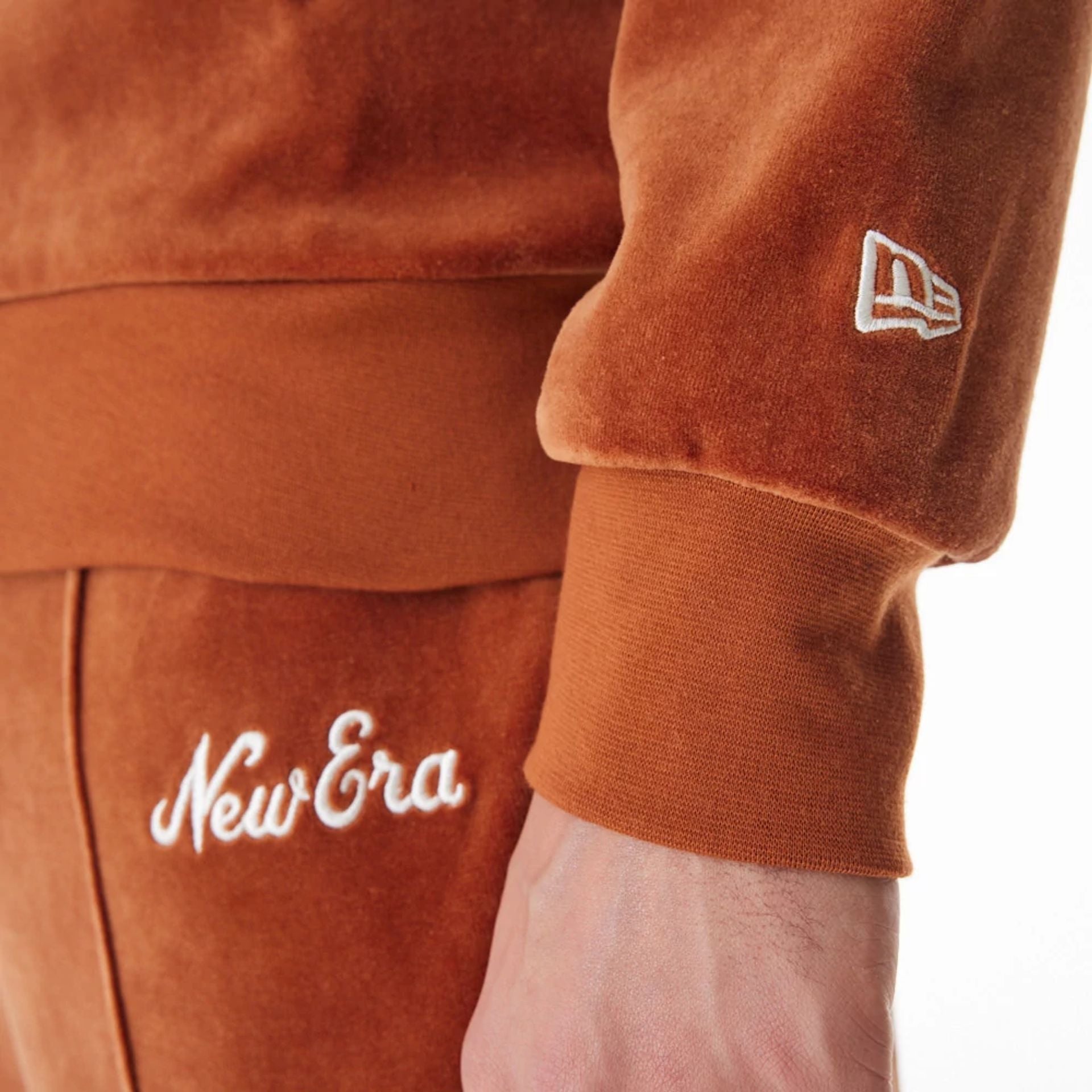 The Male model is wearing  New Era Velour Brown Track Jacket  15