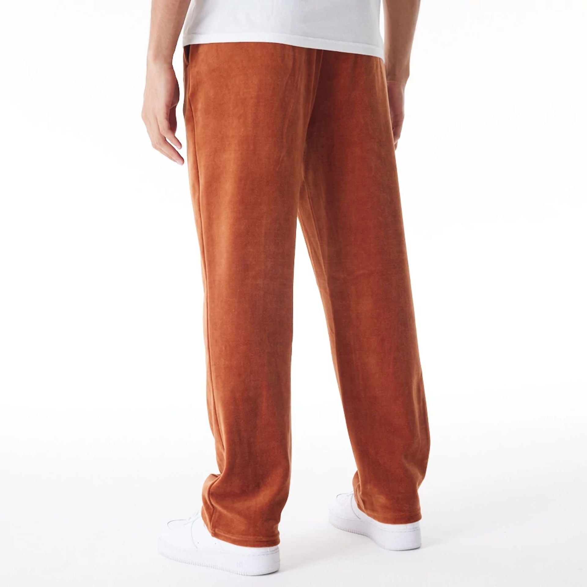 The Male model is wearing  New Era Velour Brown Track Joggers  2