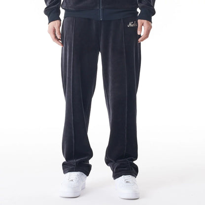 The Male model is wearing  New Era Velour Black Track Joggers  7