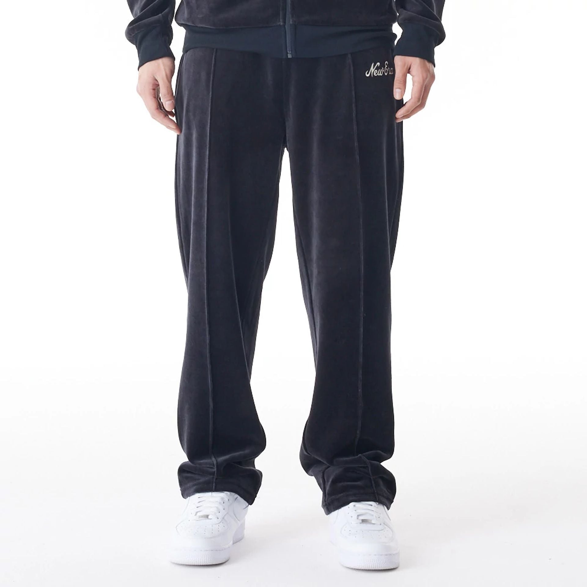 The Male model is wearing  New Era Velour Black Track Joggers  7