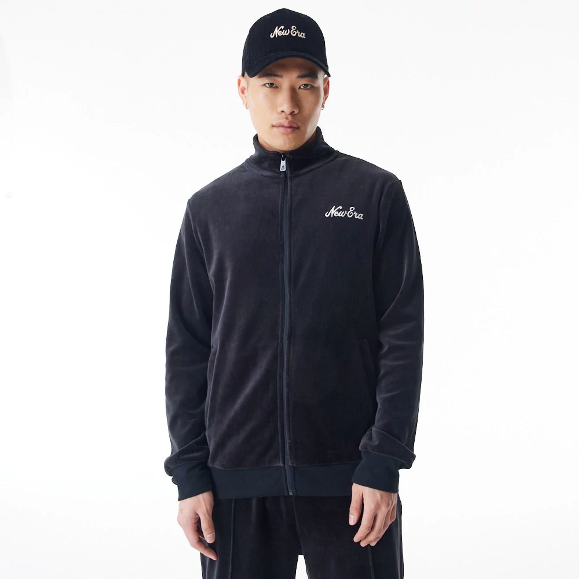 The Male model is wearing  New Era Velour Black Track Jacket  2