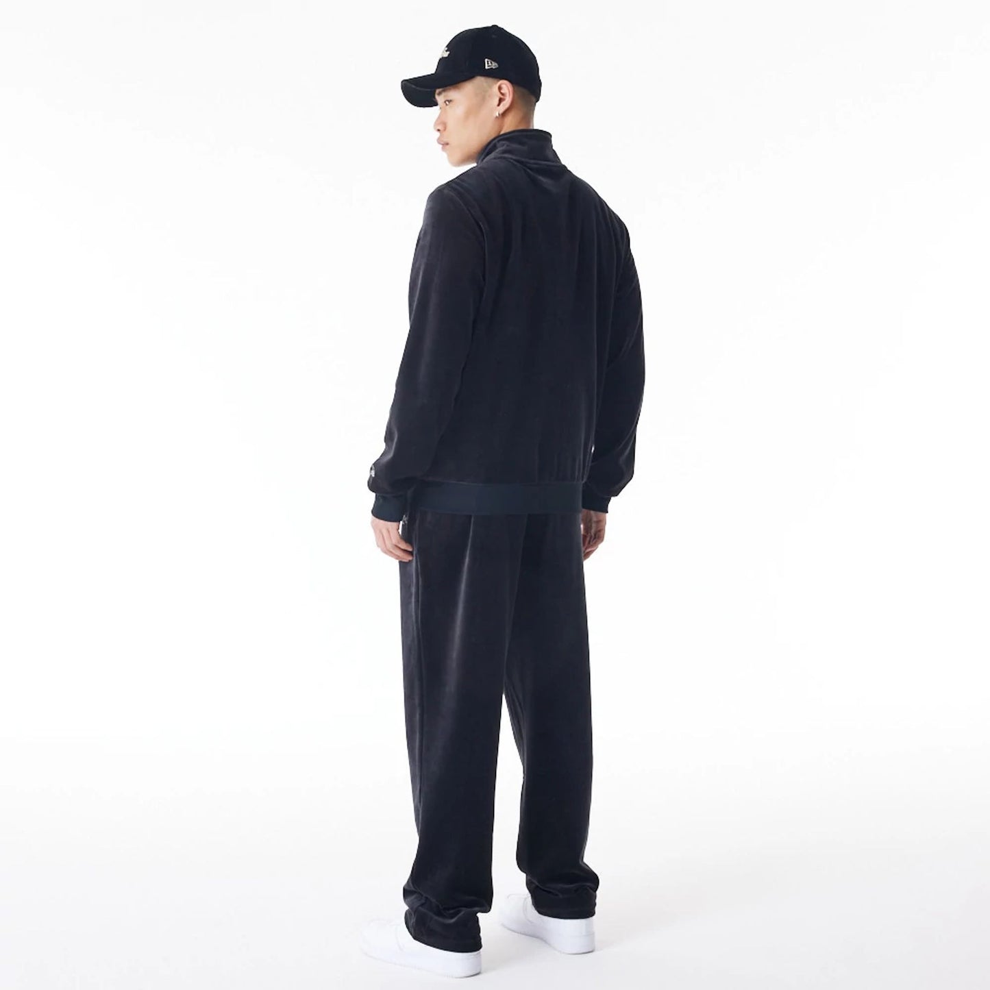 The Male model is wearing  New Era Velour Black Track Jacket  5