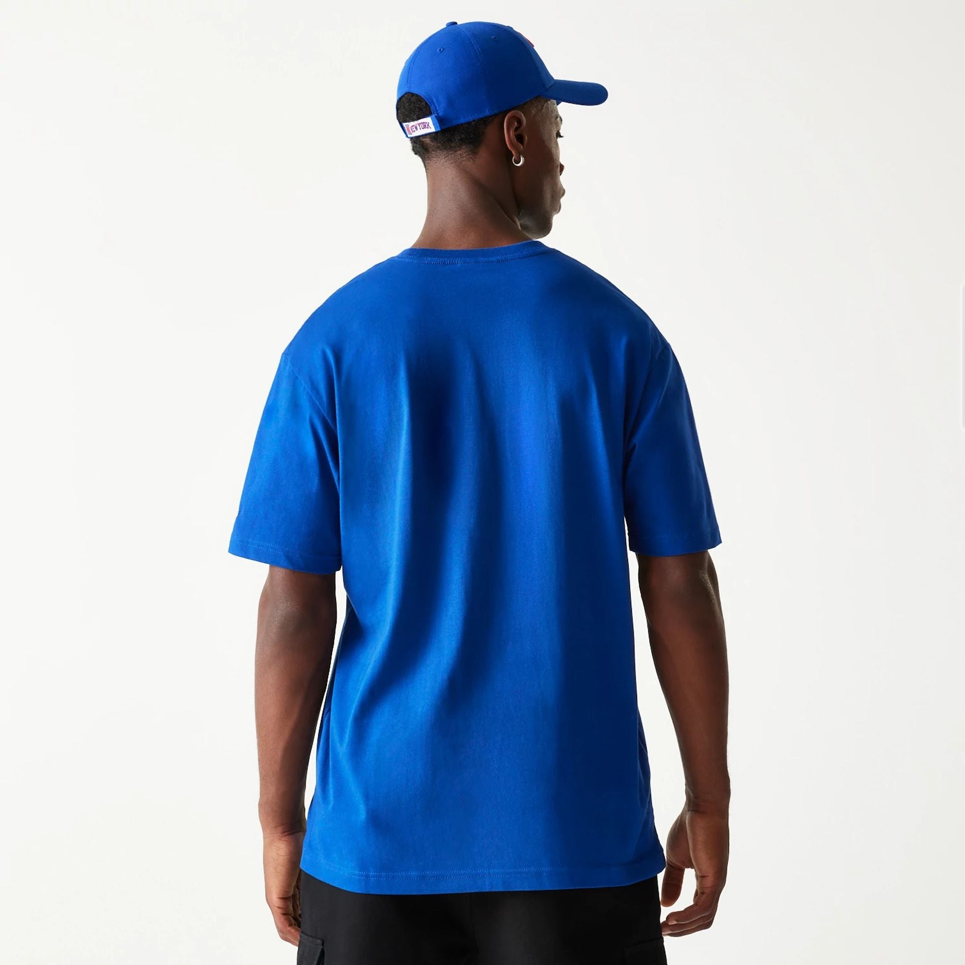 The Male model is wearing New York Knicks Sport Classic Blue T-Shirt 2