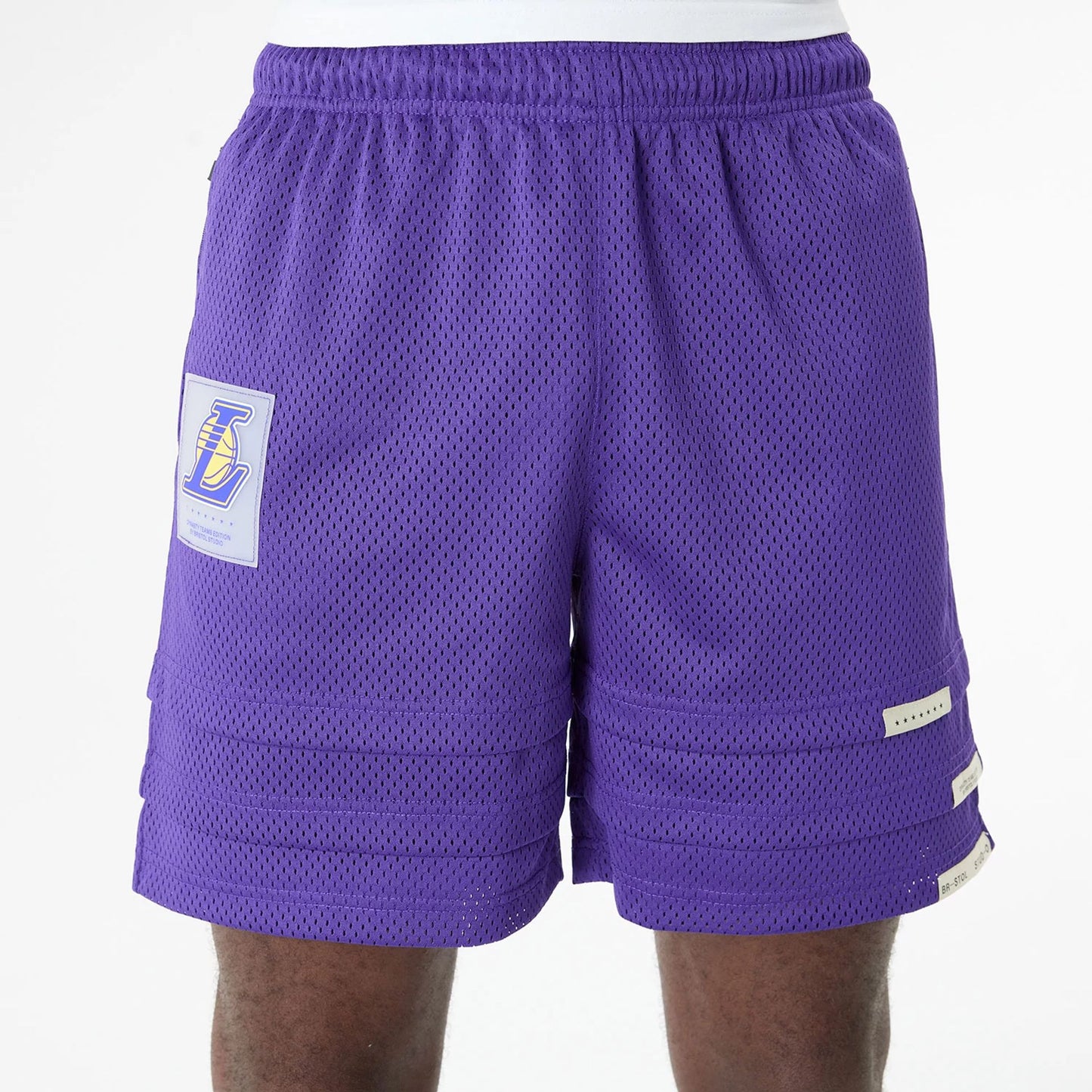 The Male model is wearing LA Lakers Bristol Studio x NBA Purple Shorts 3