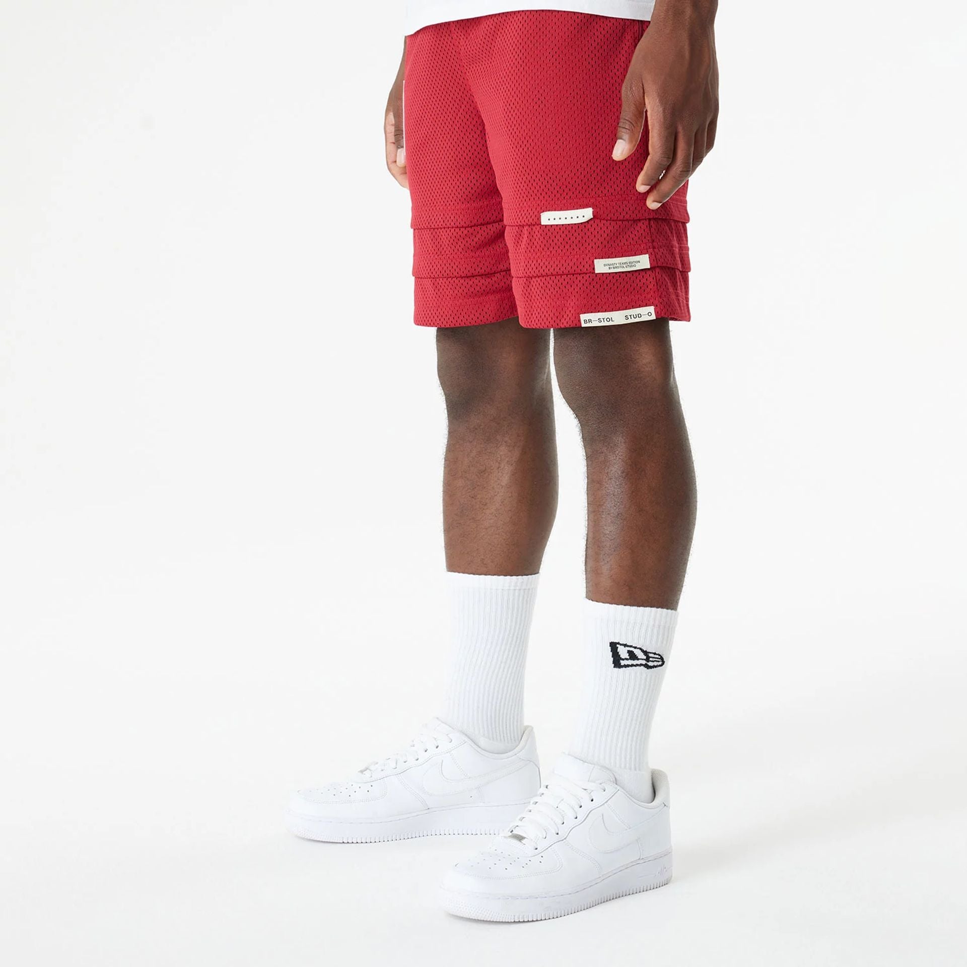 The Male model is wearing Miami Heat Bristol Studio x NBA Dark Red Shorts 7