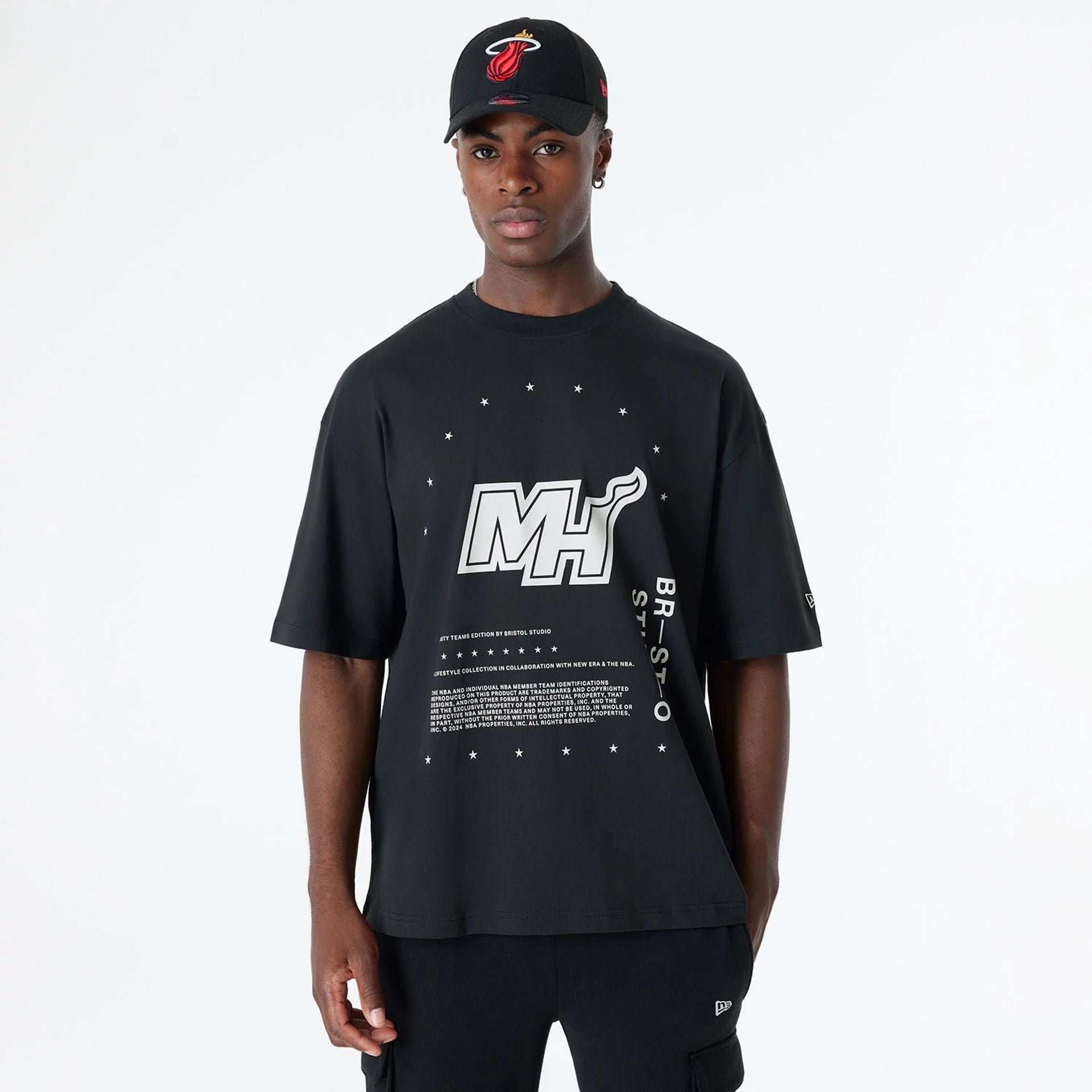 The Male model is wearing Miami Heat Bristol Studio x NBA Black Oversized T-Shirt 1