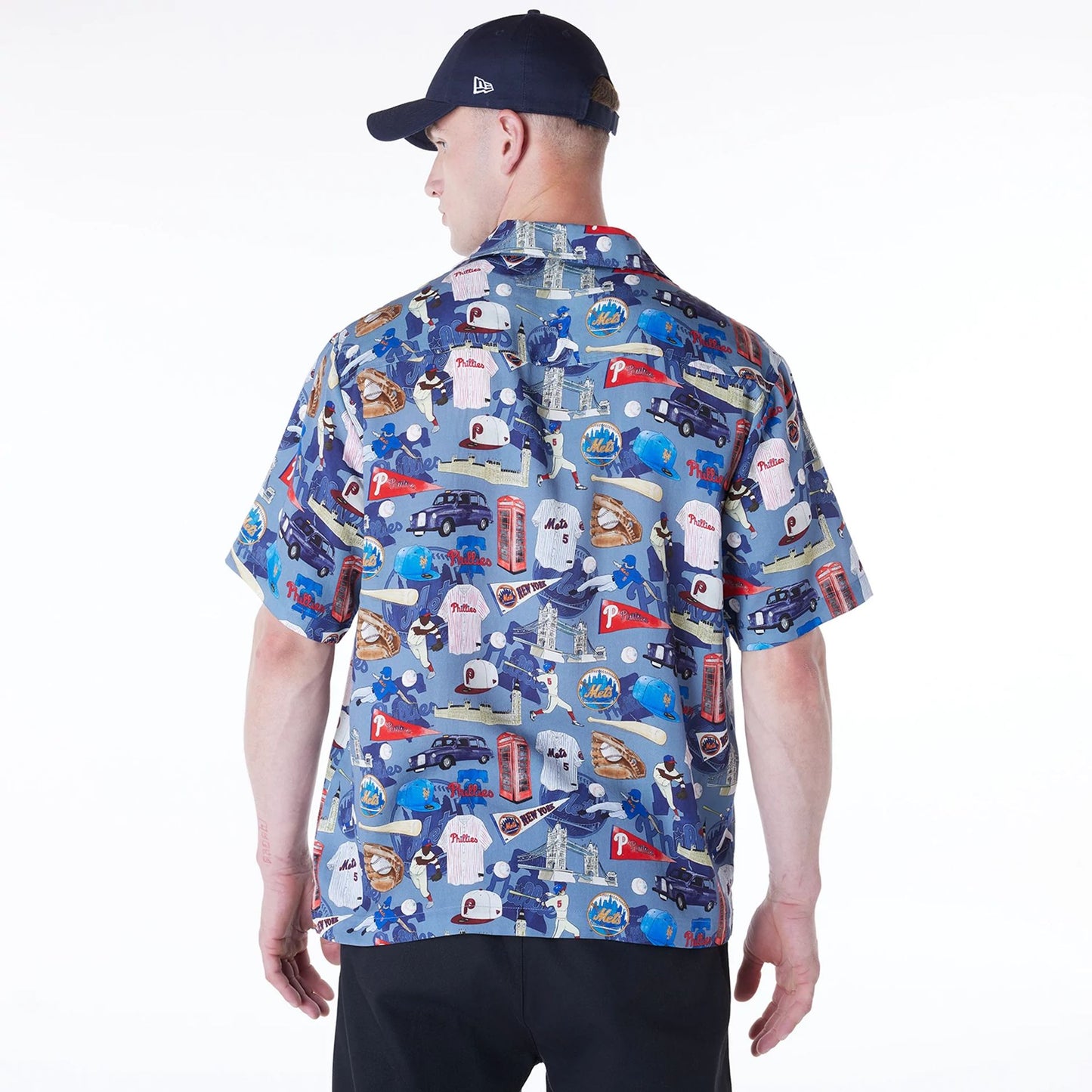 The Male model is wearing MLB Multi Team MLB London Games 2024 Revere Navy Short Sleeve Shirt 4