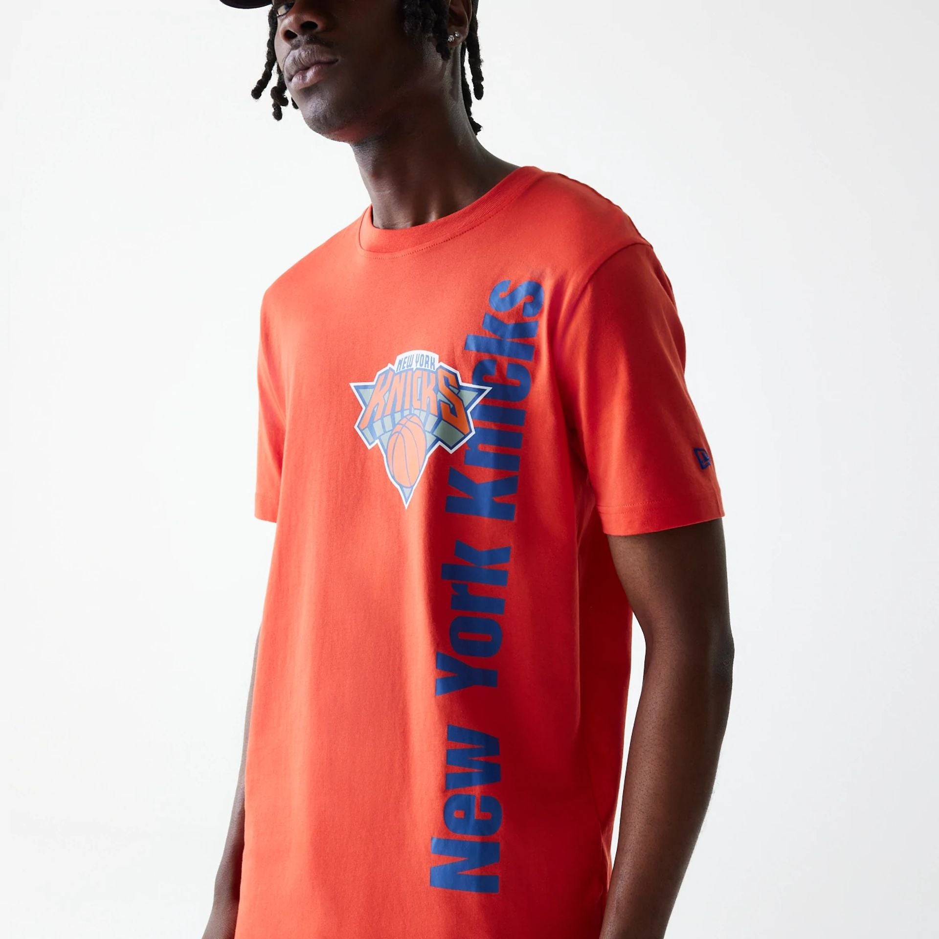 The Male model is wearing New York Knicks NBA City Edition Orange T-Shirt 3