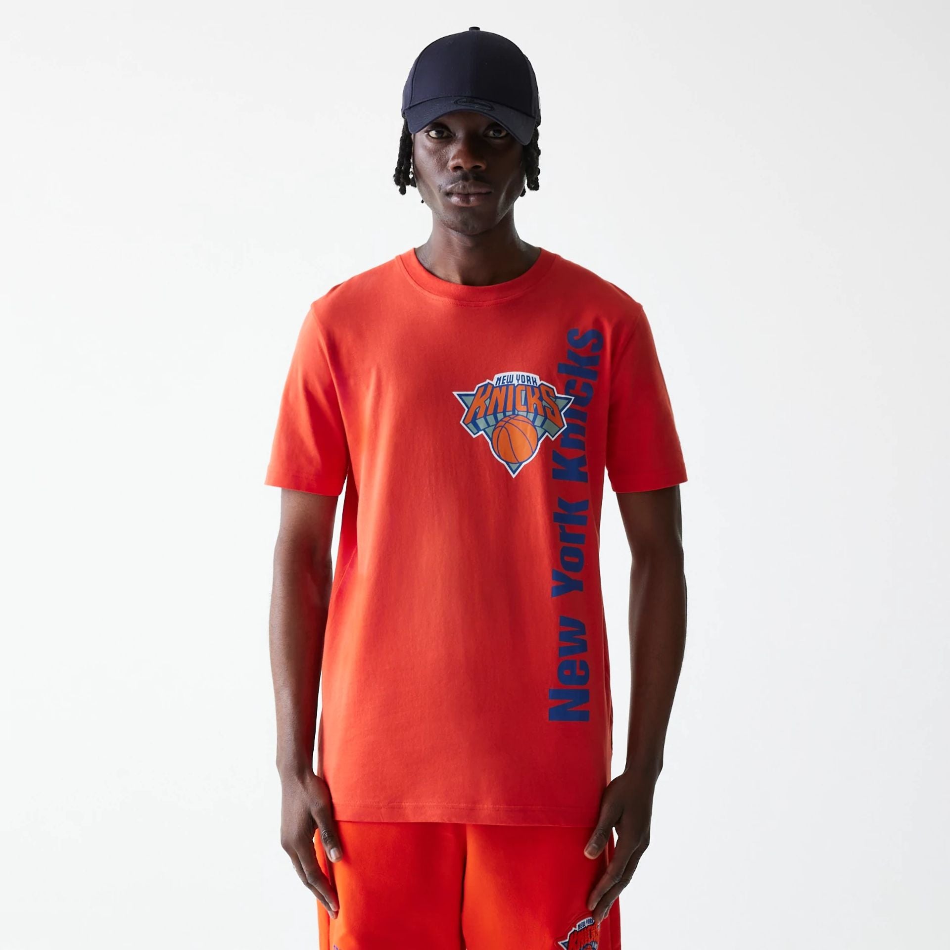 The Male model is wearing New York Knicks NBA City Edition Orange T-Shirt 1